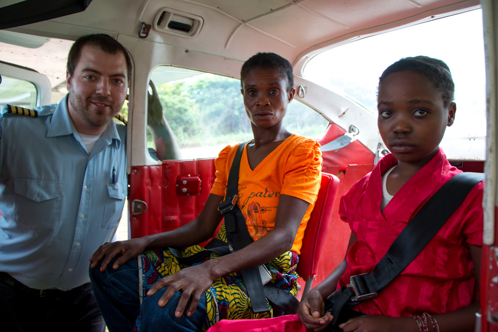 Masha and her mother with MAF pilot Kevin Spann. Photo by Mark & Kelly Hewes.