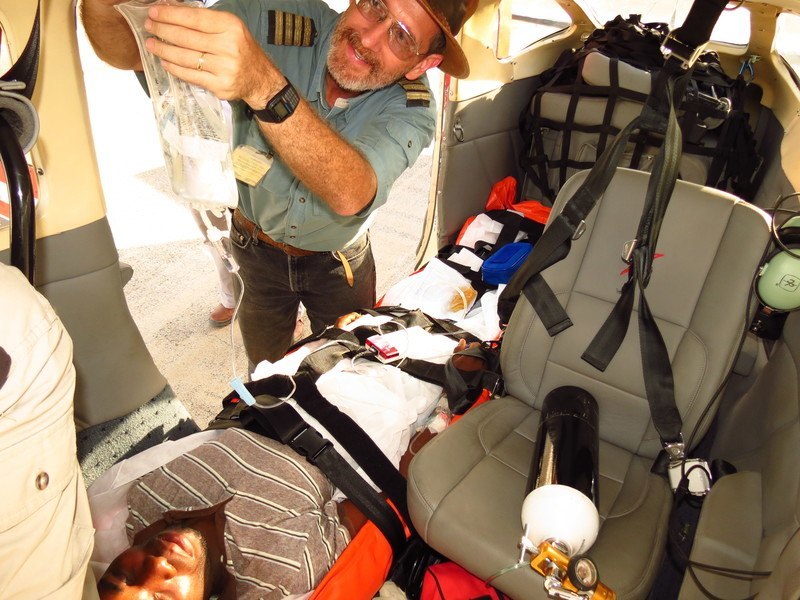 Dave LePoidevin preps a patient prior to a medevac flight.