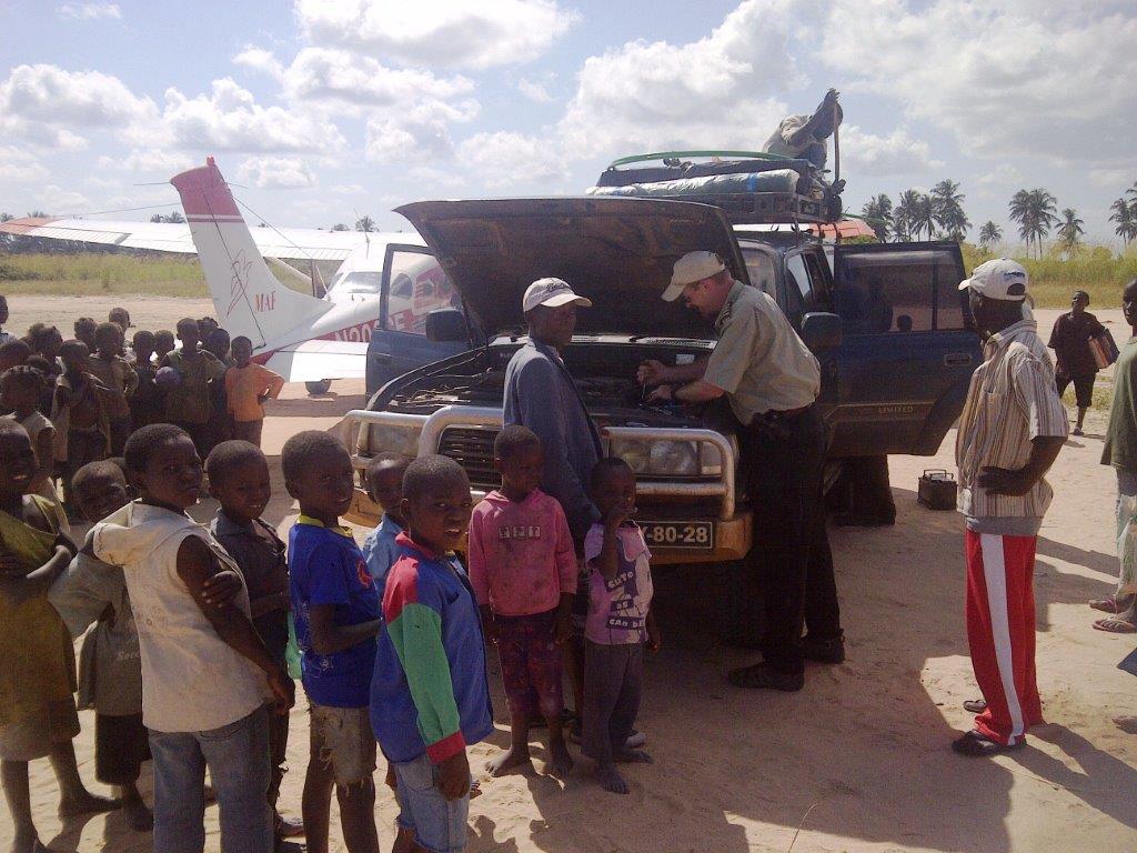 Dave Holmes delivers much-needed supplies to the NTM missionaries, and fixes their car's battery. Photo by Nadia Hattingh.