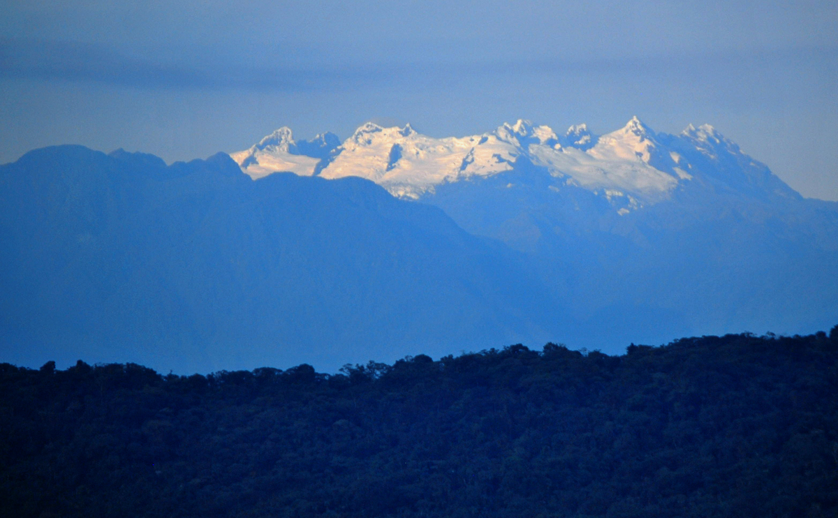 The volcano, Altar, rises in the distance.