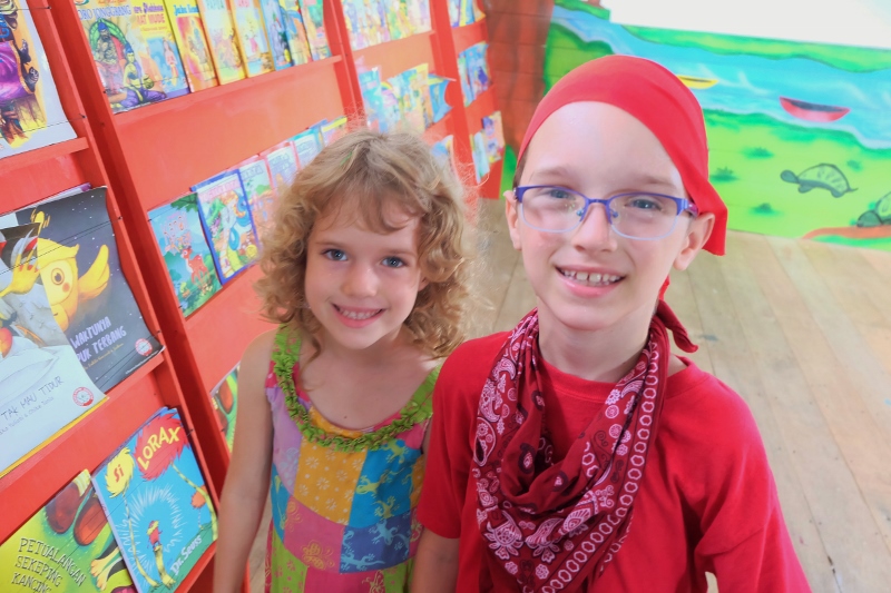 Evan (dressed as a pirate) and Renea inside new library.