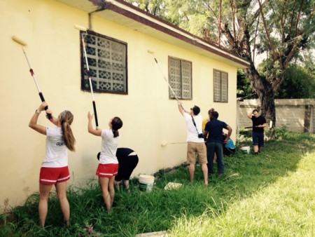 The NNU team painting the exterior of the orphanage. 