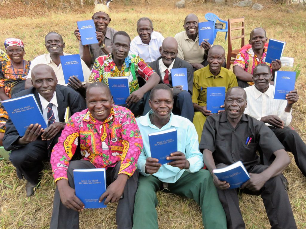 Logo men with their new Bibles. Photo courtesy of Doug Wright.