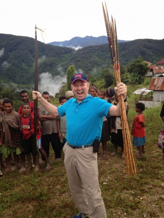 John Beam’s antics amuse children during a visit to an interior village.