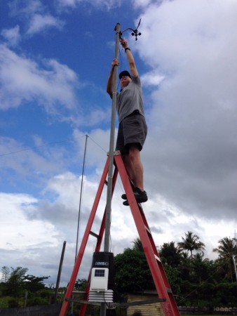 Lee Calhoun helps install a weather station in Tarakan, Indonesia, for testing before the MAF team installs others at interior airstrips.