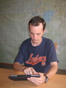 With iPad in hand, pilot Joey Martin goes over documents in his electronic flight bag.