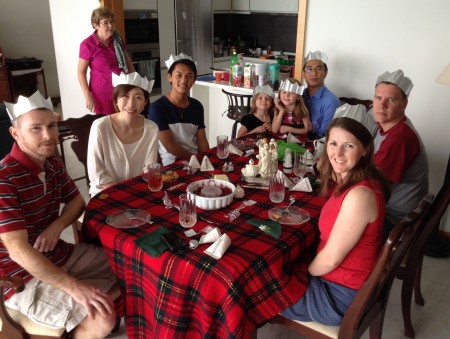 Christmas in Singapore at the Calhoun’s condo: Laura and Steve Persenaire (right) with Laura’s brother (left), and Bible school students from the Calhoun’s church.