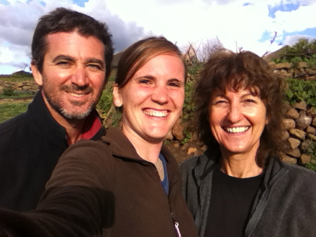 Justin and his wife Amanda (center) with Merrill on a recent encouragement trip to Merrill's village.
