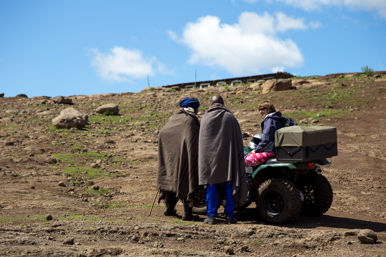 Merrill chats with villagers on her way to the airstrip. Photo by Mark and Kelly Hewes.