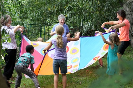 A rousing parachute game. Photo by Jocelyn Frey.