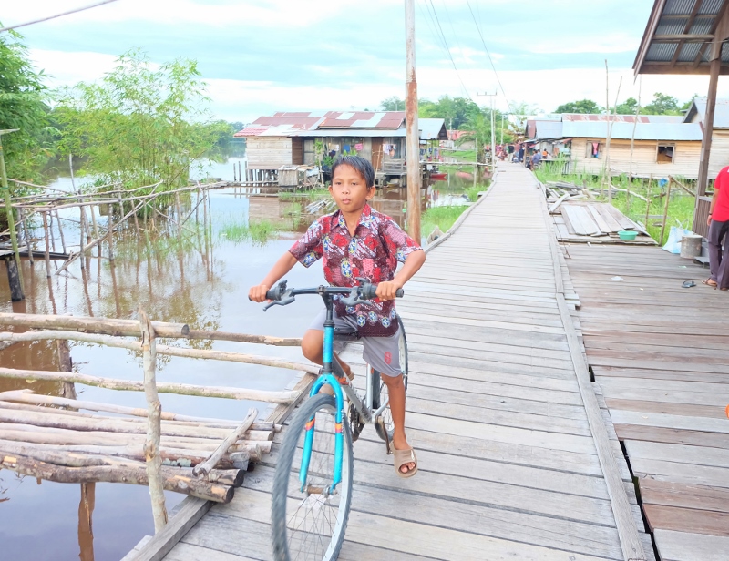 In this river village all the houses (and library) are on stilts over edge of river. All photos by Rebecca Hopkins.