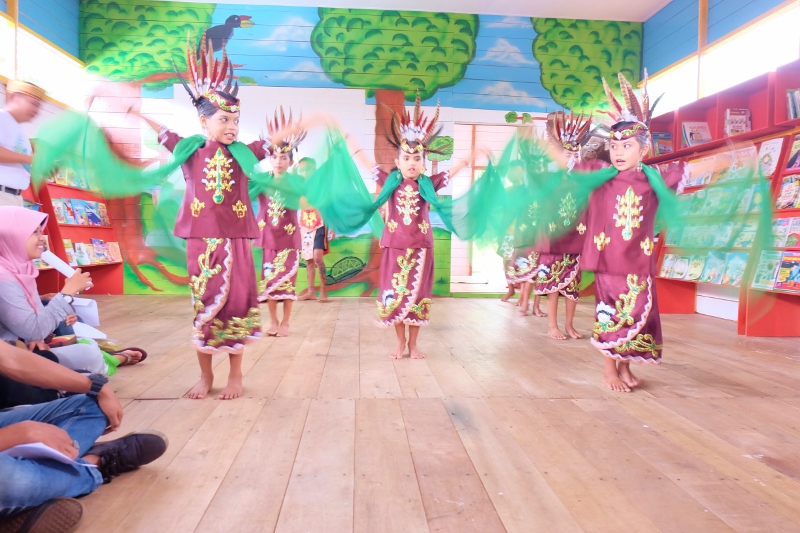 Village kids dancing like birds for the library opening.