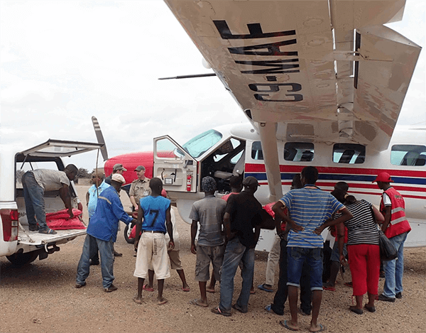 Rice and flour is loaded into an MAF airplane in Caia, Mozambique for delivery to Marromeu.